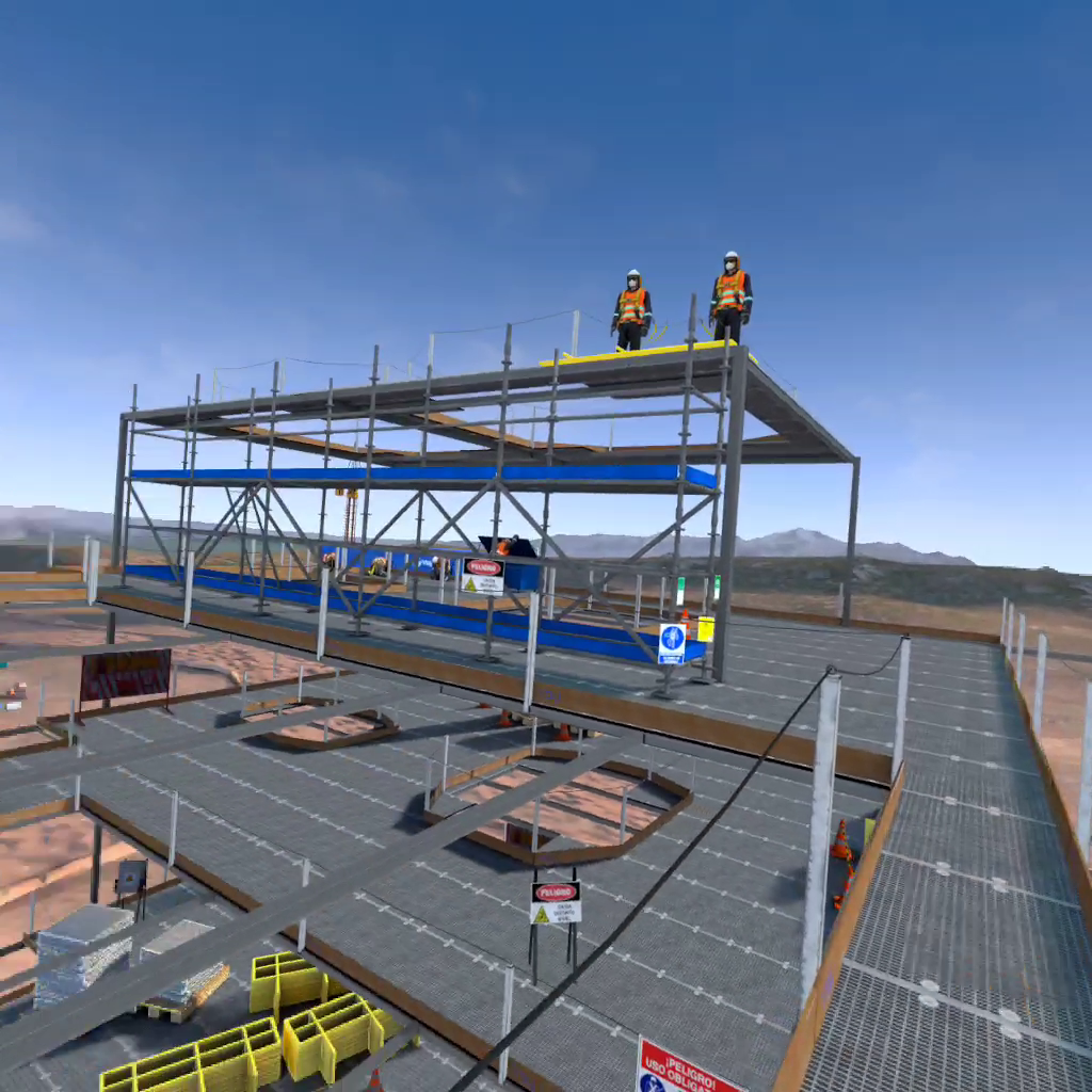 Construction site with steel framework and workers wearing safety harnesses, helmets, and vests on an upper level. Desert landscape in the background.