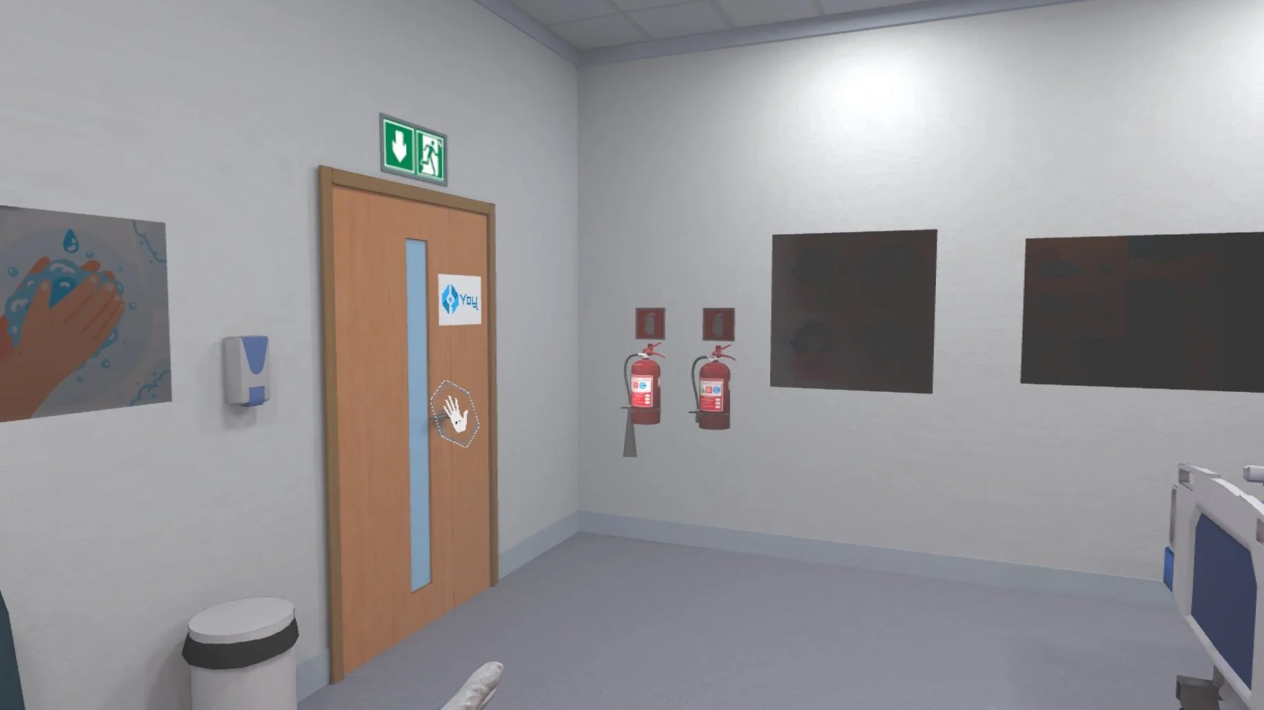 Hospital corridor with fire extinguishers, handwashing poster, exit sign, and a door with hand symbol.