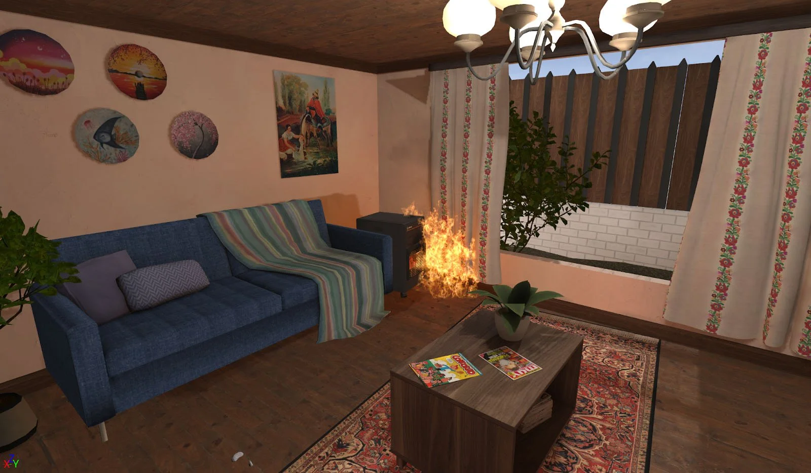 Living room with blue sofa, wall art, small table, plant, and fireplace with visible flames.