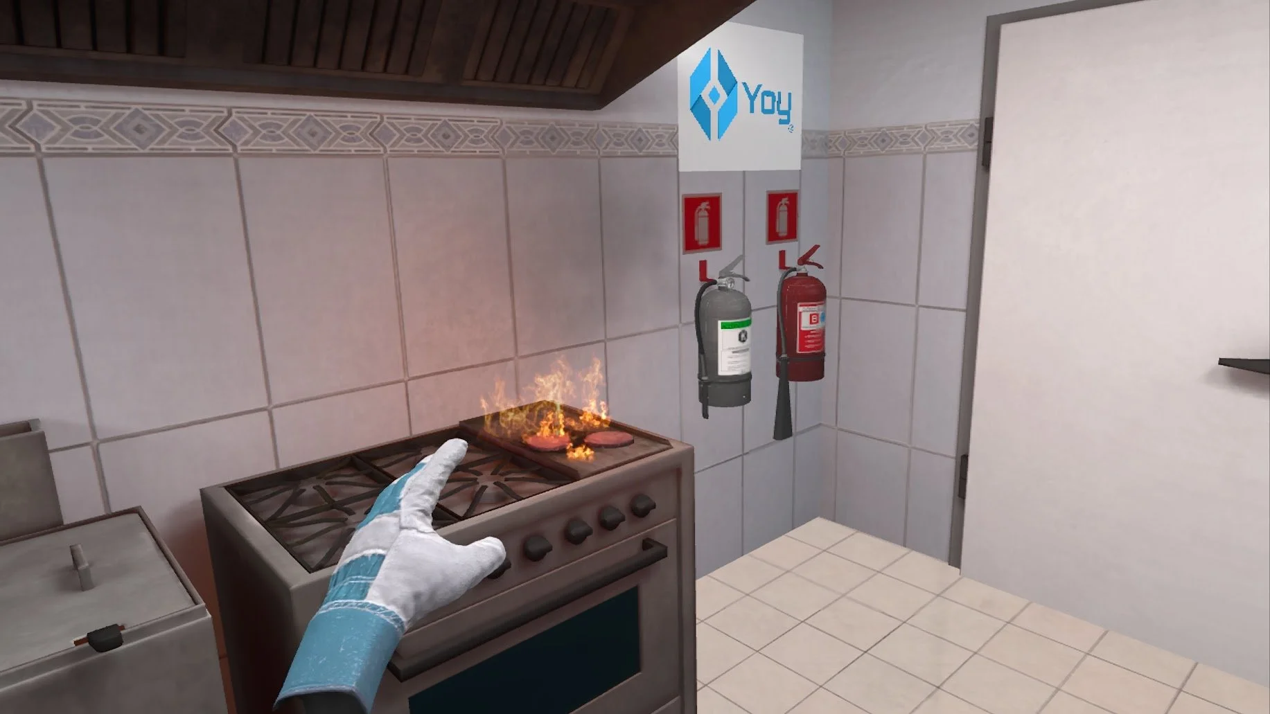 A kitchen scene with a stove on fire, showing flames on a burner. A gloved hand points towards the stove. Two fire extinguishers are mounted on the tiled wall near a partially visible door.