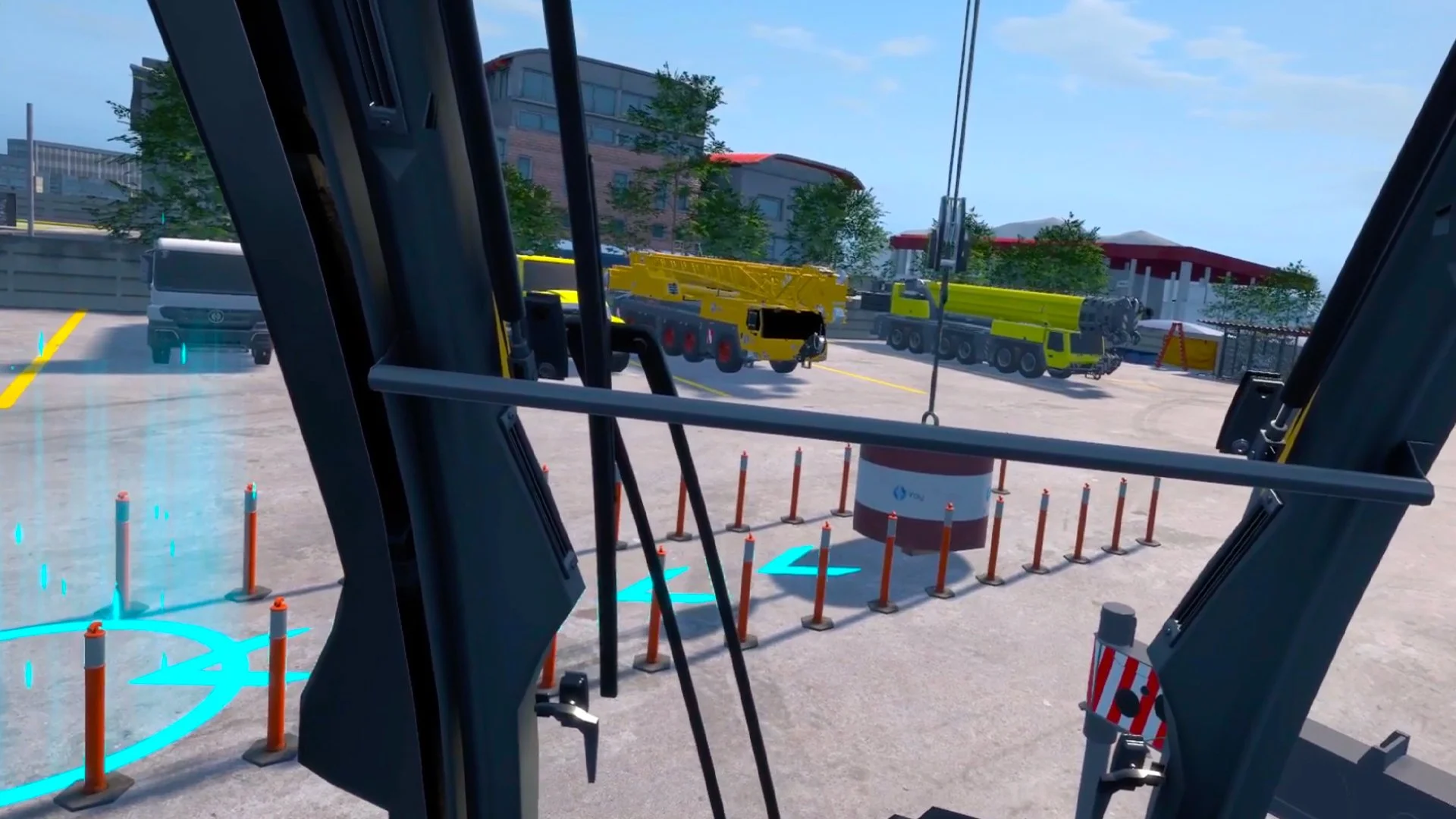 View from inside a construction vehicle cab, showing a construction site with cranes, trucks, and safety barriers.